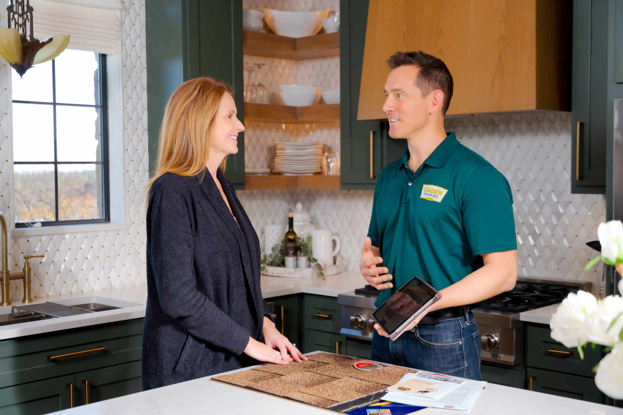 Caden Roofing Roof Advisor giving a homeowner a free in-home roof consultation